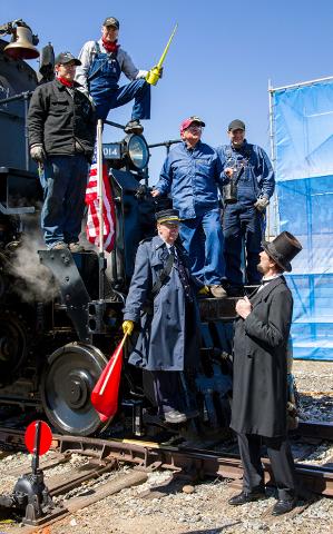 Ed Dickens with oil can and his the crew of No. 4014 greet President Abraham Lincoln.