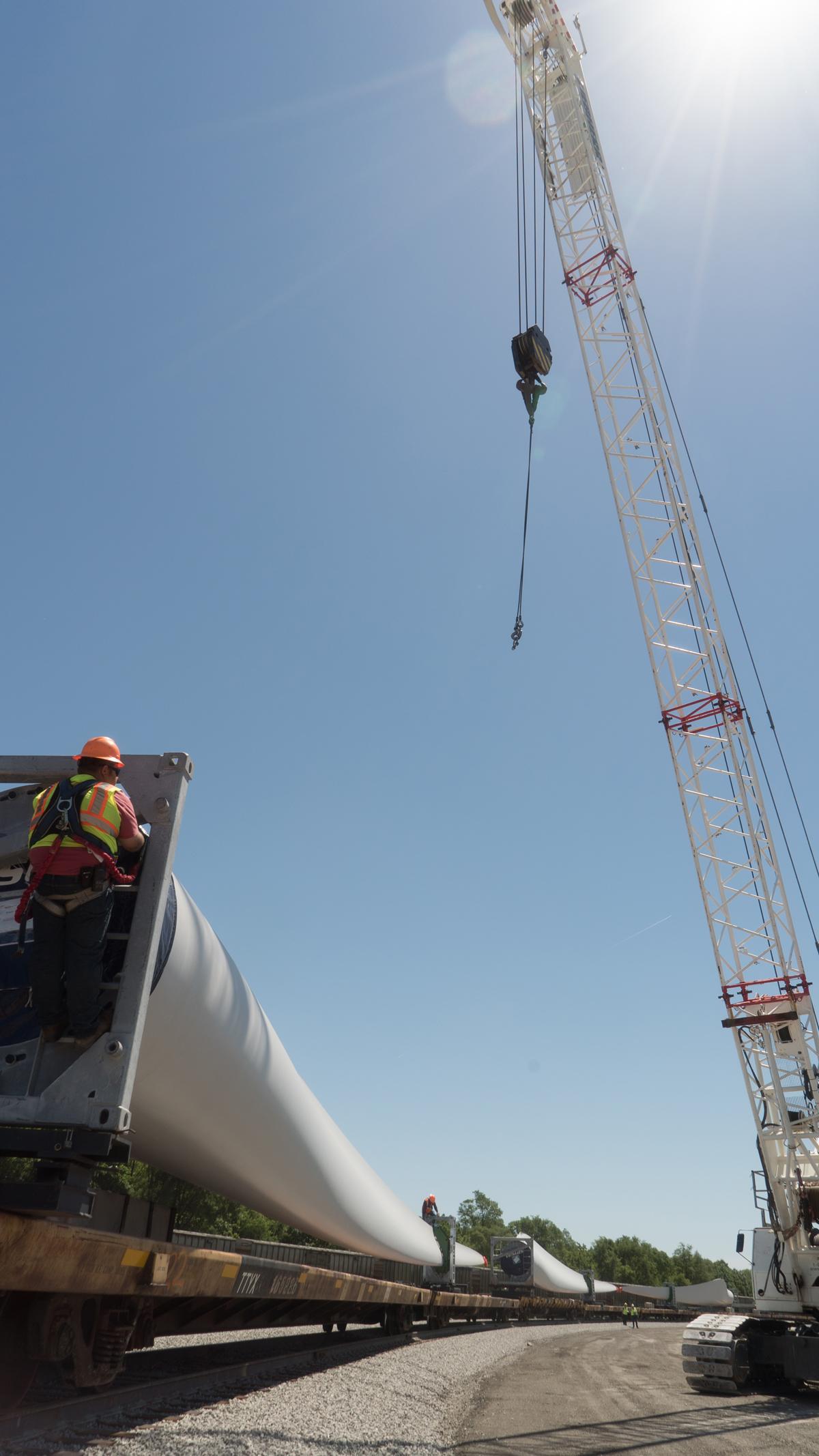 Unloading components to build a wind turbine farm near Des Moines, Iowa.