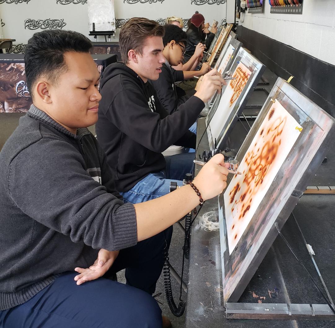 The students toured a local paint shop to see how automobiles get their color. Along the way, program participants were able to try their hand, testing out different painting techniques.