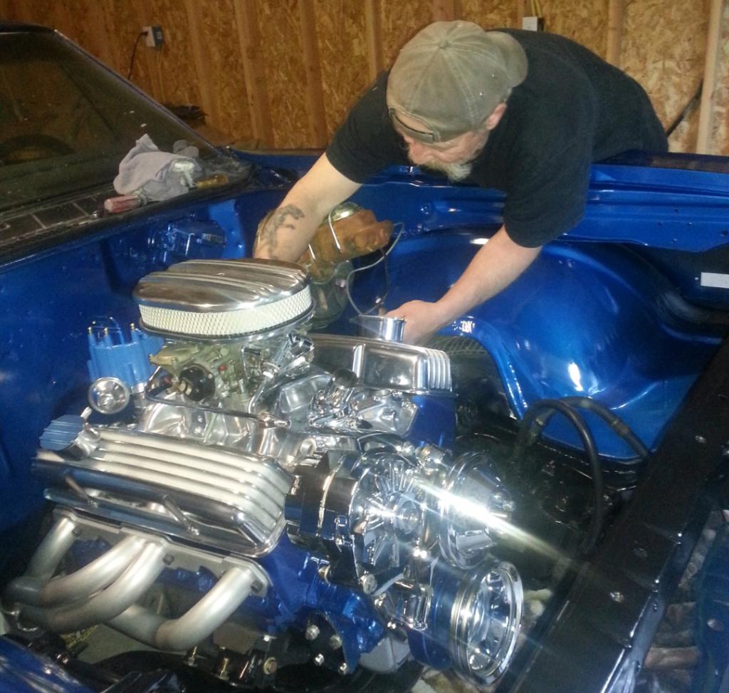 Large | Richard's friend installing the motor on his 1968 Chevelle