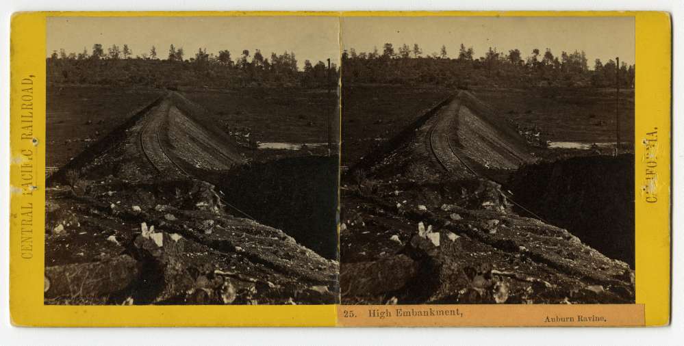A stereo card of the tracks along a high embankment in Auburn Ravine