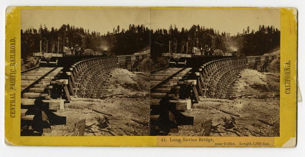 A stereo card of the 1,050 feet Long Ravine Bridge stands near Colfax, California