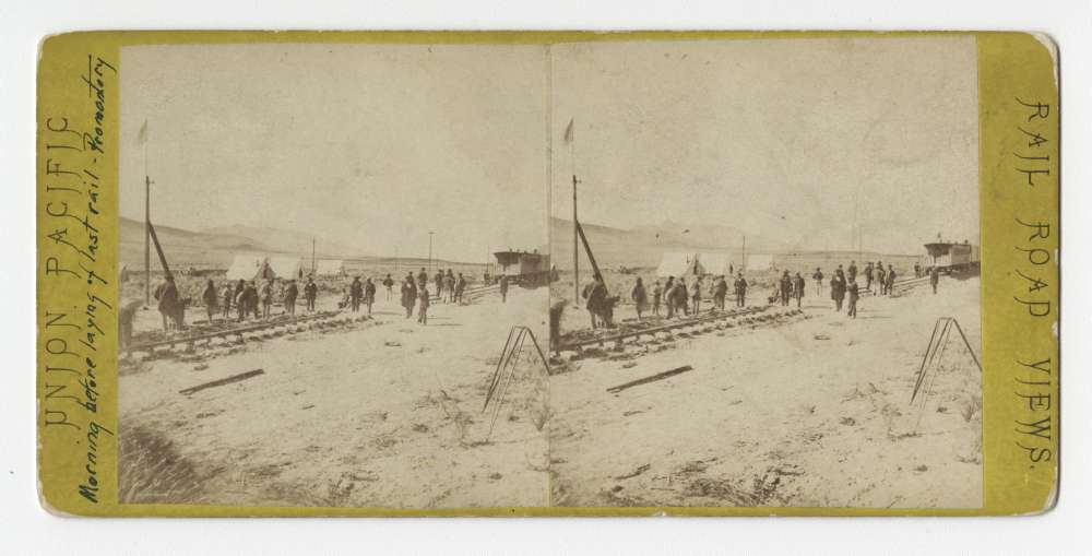 A stereo card showing the morning before laying of the last rail in Promontory