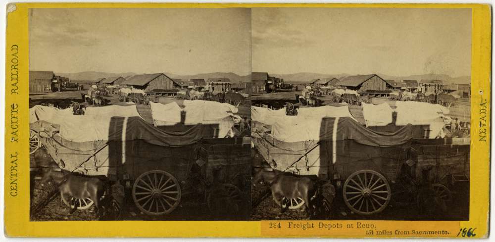A stereo card showing wagons being assembled at the freight depot in Reno, Nevada