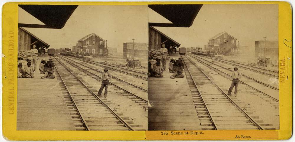 A stereo card showing men gathering at the Reno, Nevada depot