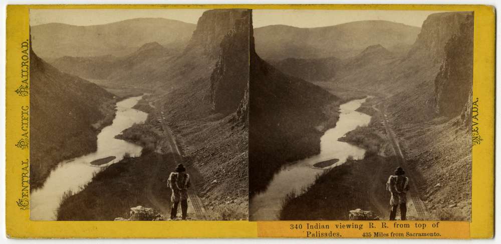 A stereo card showing a member of the Shoshone Nation standing on a bluff in the Palisades
