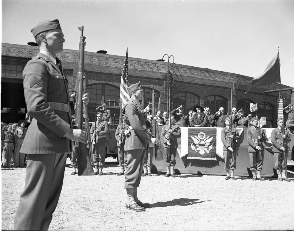 Photograph of a flag raising ceremony in Sparks, Nevada, to support war bonds, 1945