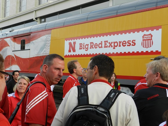 Bo Pelini and Tim Miles chat while boarding the Big Red
Express at Omaha