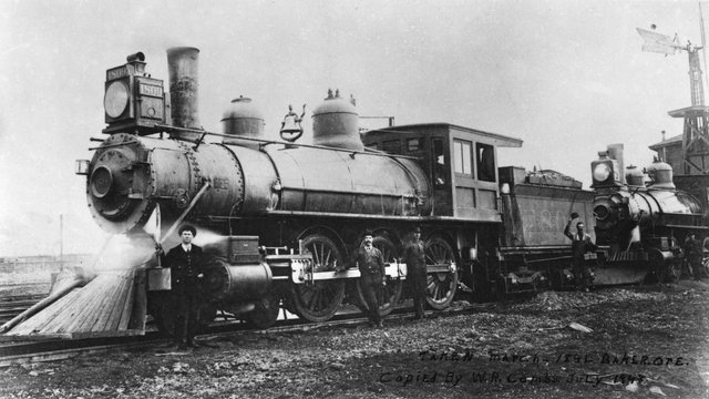 Old picture of two men in a train