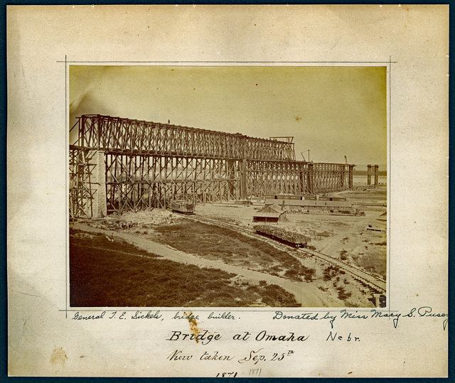General J.E Sickels, bridge builder. Donated by Miss Mary S. Pusey. Bridge at Omaha Nebraska. View taken Sep. 25th, 1871. "The first Missouri Bridge, Omaha, Nebraska. Picture from the effects of Gen. J.E. Sickels, builder of this bridge. Donated by his granddaughter, Miss Mary S. Pusey, Philadelphia. Union Pacific Historical Museum. Feb, 1948".