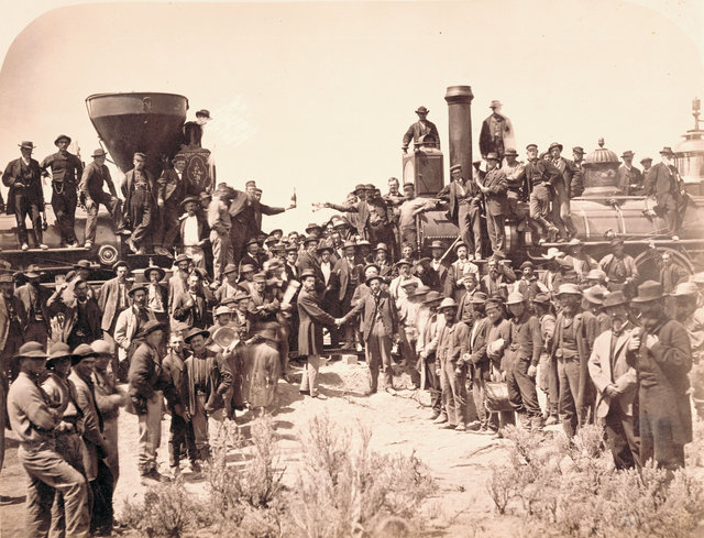 Plate 227, "East and West shaking hands at laying of the last rail," Promontory Summit, Utah. Photograph was taken by Andrew Russell on May 10, 1869. General Dodge, chief engineer for Union Pacific, is pictured shaking hands on the right, with Central Pacific engineer Montague on the left. This print was created before the original glass plate was broken. The glass plate negative is in the collection of the Oakland Museum (California).