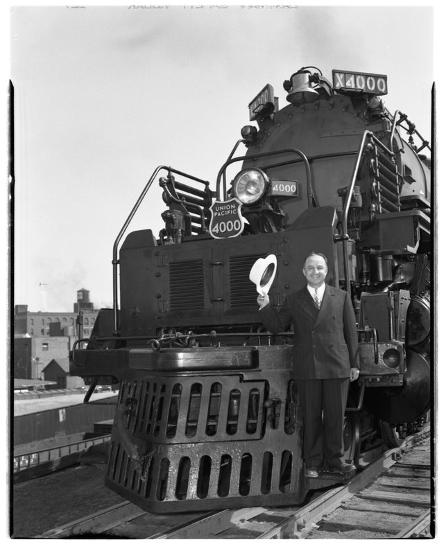 Otto Jabelmann, vice president of research and mechanical standards, standing on front steps of the new Big Boy locomotive no. 4000. Part of a series of photographs made of Big Boy locomotive no. 4000 in September 1941.