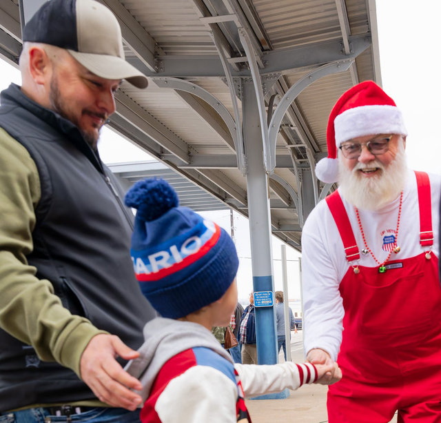 Railroad Santa greets a youngster.
