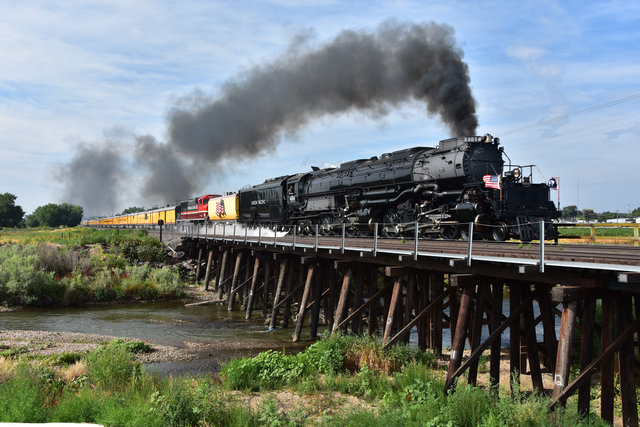 Big Boy No. 4014 and Lincoln Locomotive No. 1616 crossed the Cache la Poudre River in Colorado. 