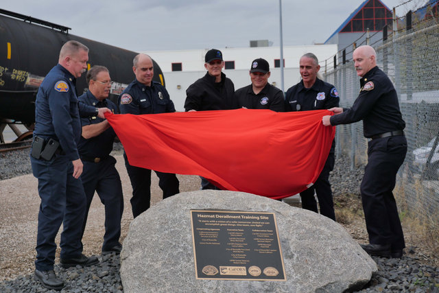 Union Pacific Safety employees Senior Director Robert Bavier and Manager Paul Holt, second and third from right, help city and state first responders dedicate a recently completed hazmat derailment training site at California’s Roseville Fire Training Center.