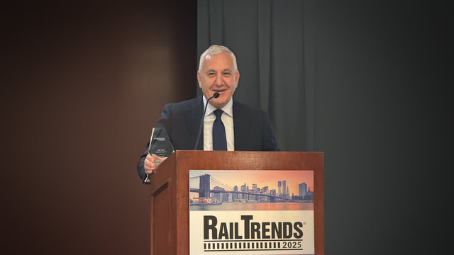 CEO Jim Vena at podium