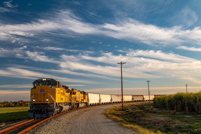 A train moves through a landscape