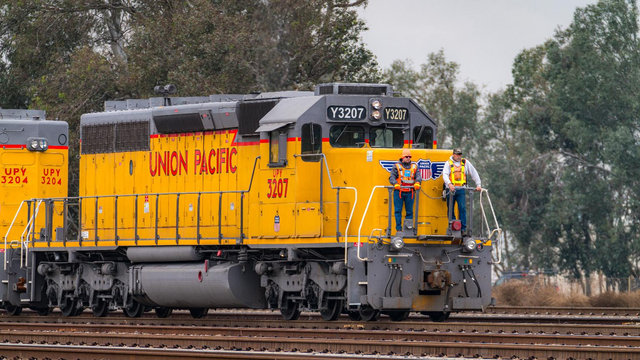 Go Home Safe_Craft professionals on front of locomotive | LR