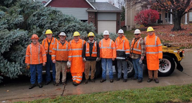UP Crew stands in front of the Durham Christmas Tree | MR