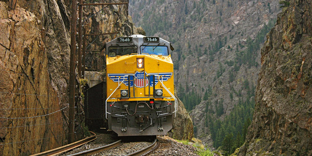 UP locomotive passes through rocky mountain area | LR