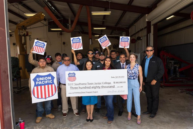 Large | SWTJC Students and UP employees pose behind $380,000 check
