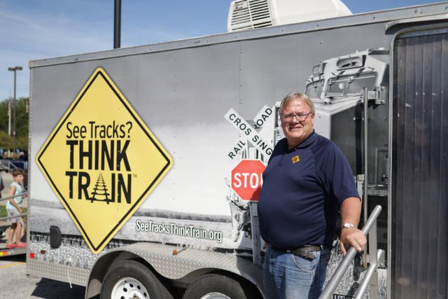 Volunteer Rob Kennedy with Operation Lifesaver truck. | L
