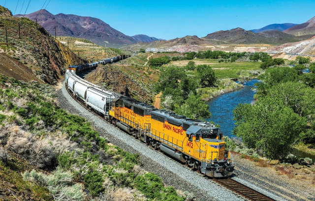 Locomotive moving through a hilly area | MR