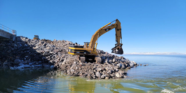 The railroad helped raise the causeway berm to create a healthier, less salty lake.
