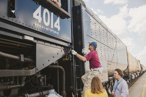 2024 Investor Day participant climbs in cab of Big Boy No. 4014. | S