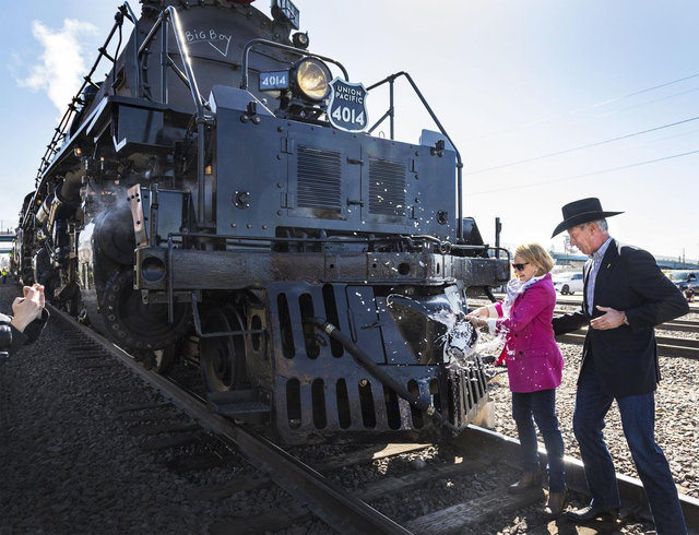 Ceremonial christening of Union Pacific Big Boy No. 4014, with people gathered around the locomotive during a formal event.