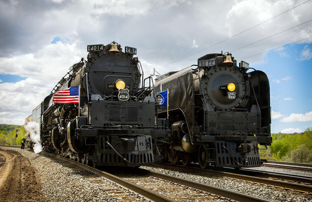 Three-quarter front view of Union Pacific steam locomotives No. 844 and Big Boy No. 4014 side by side during a heritage run.