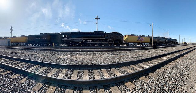 Union Pacific steam locomotives No. 844 and Big Boy No. 4014 traveling together on parallel tracks during a special run.