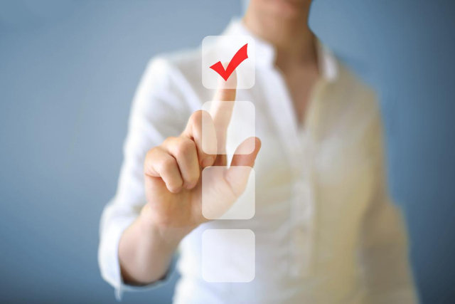A person checking a virtual checkbox