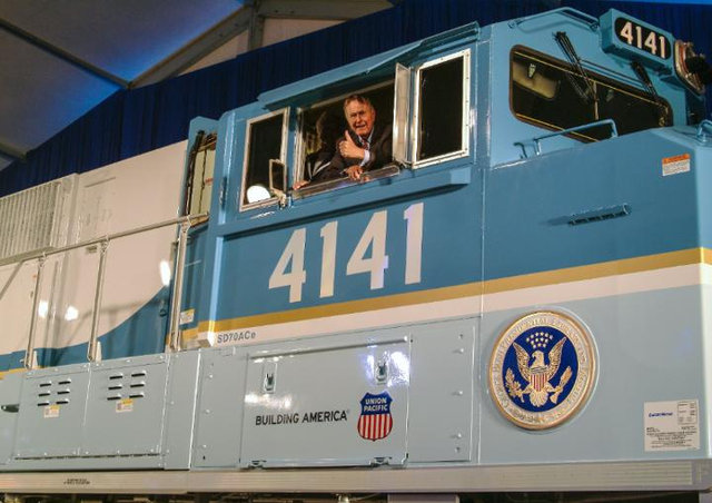 Medium | George H.W. Bush in the cab of UP Locomotive No. 4141