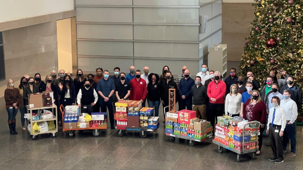 Large | Supply employees with their 2021 Canned Food Drive Donations