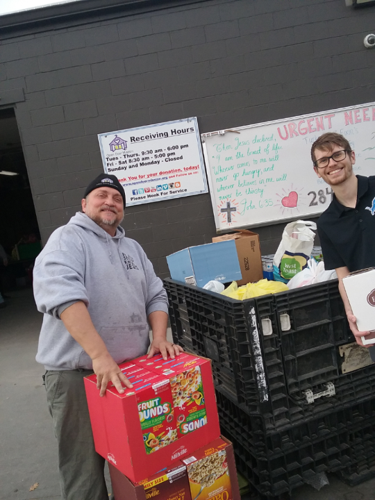 Medium | Supply employees delivering food to Omahaâs Open Door Mission.