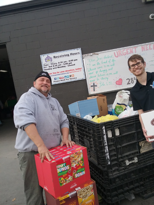 Medium | Supply employees delivering food to Omahaâs Open Door Mission.