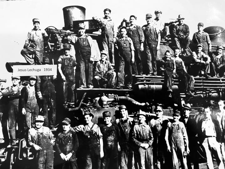 Jesus Lechuga and his work crew stand before a Southern Pacific steam locomotive in 1934.