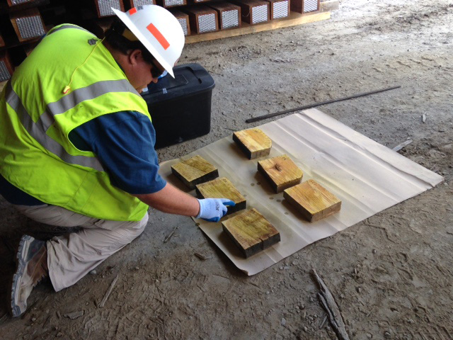 Nate Irby inspecting wood ties.