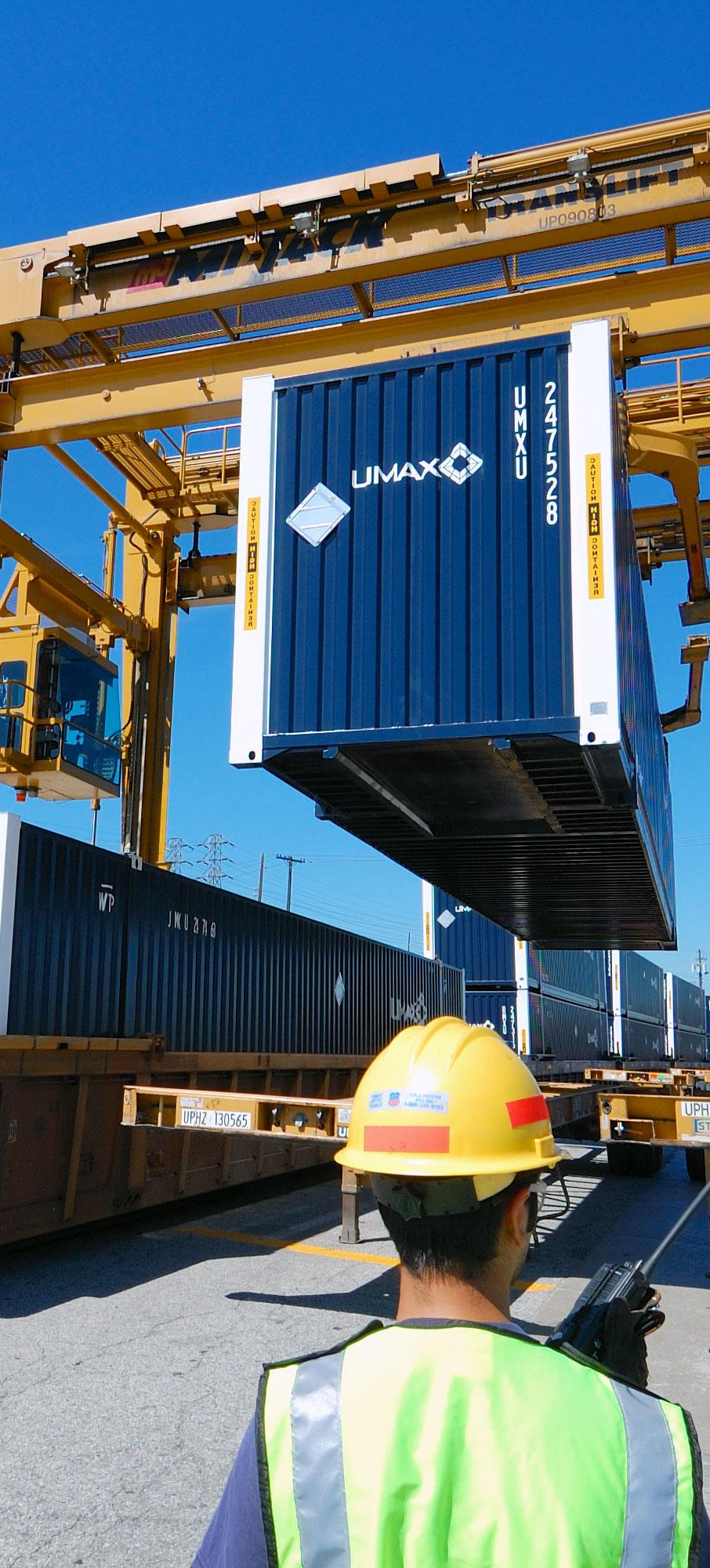 UMAX intermodal containers are being loaded onto a train for departure from City of Industry in Los Angeles, California.