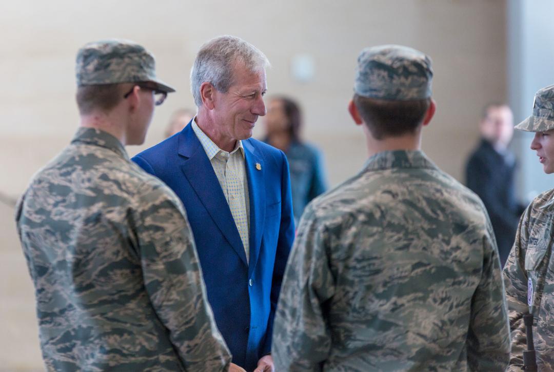 Chairman, President and CEO Lance Fritz meets members of the Bellevue East High School ROTC drill team, from Bellevue, Nebraska, who performed during the special Veterans Day event.