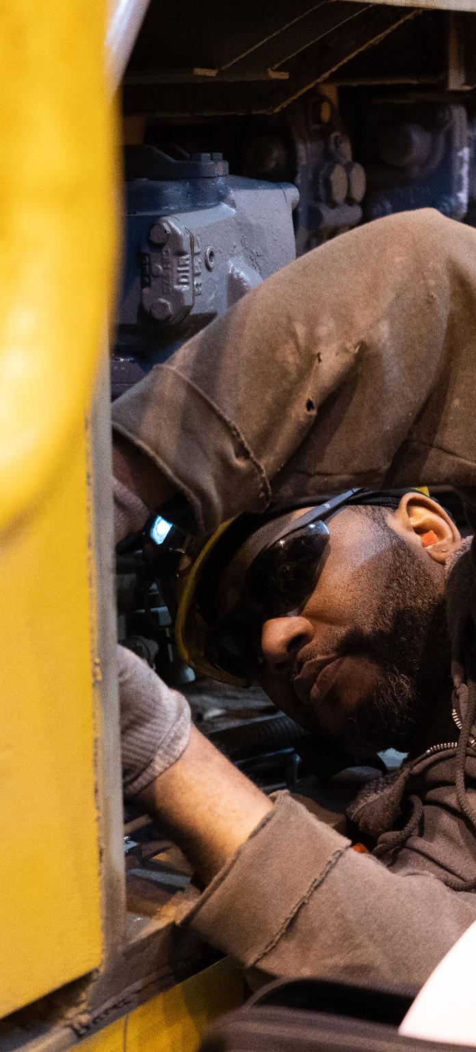 Electrician Everette Parks works on equipment in the Fort Worth, Texas, locomotive shop.