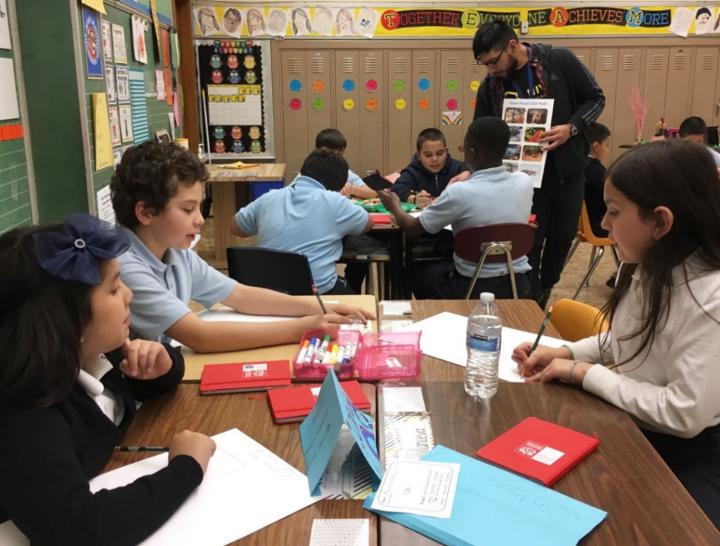 Students discuss a group science project in St. Nicholas of Tolentine School’s science club, a program supported by the Big Shoulders Fund.