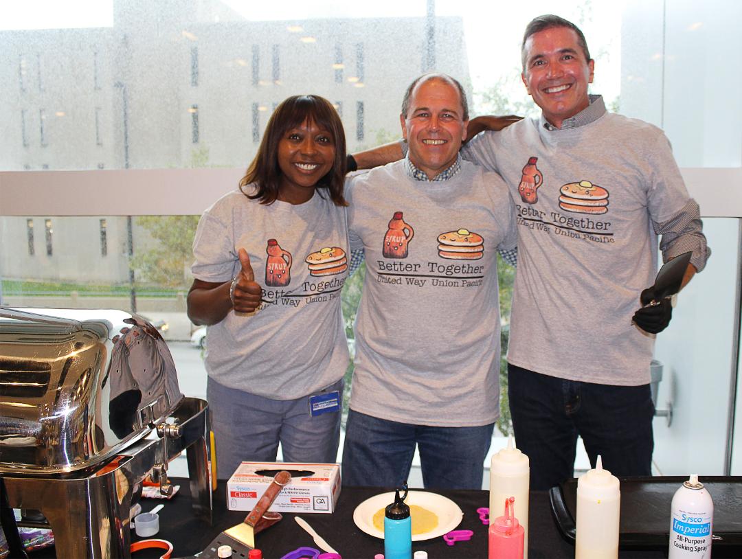 A pancake feed at Union Pacifc Center in Omaha, Nebraska, featured the leadership team as celebrity chefs and raised more than $2,600 toward the company's United Way goal. From left, Rhonda Ferguson, executive vice president, chief legal offcer and corporate secretary; Lee Myers, assistant vice president-Risk Management; and Tom Andreoli, vice president-Law.