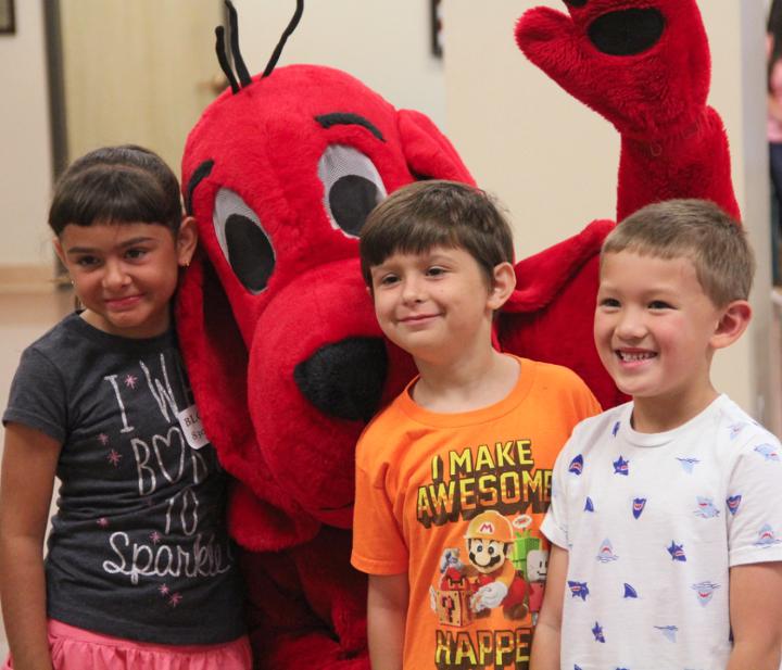 Clifford the Big Red Dog visits students at an elementary school in Pleasanton, Texas, to share his book about rail safety. (Photo courtesy The Pleasanton Express)