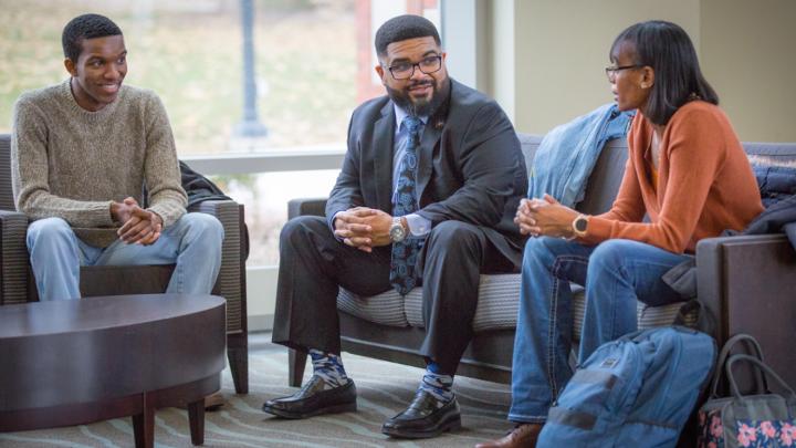 Christopher Whitt, PhD, center, Creighton vice provost for Institutional Diversity and Inclusion with Heider College of Business student Traemon Anderson, left, and School of Law student Jamel Walker, right, says the scholars program extends beyond an excellent education.
