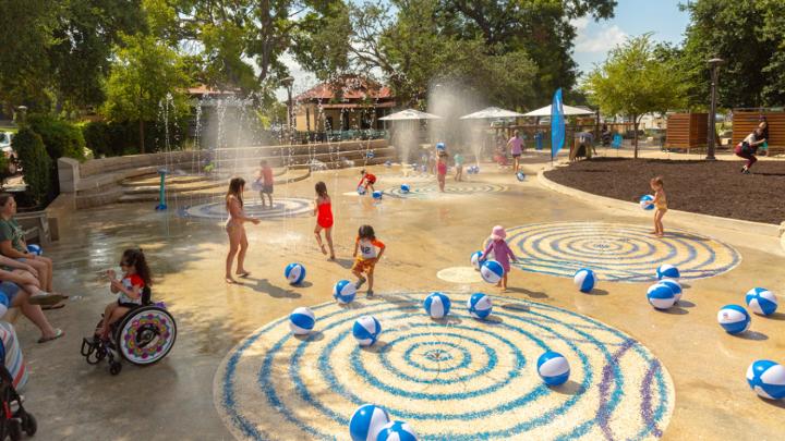 The Union Pacific Splash Pad at Yanaguana Gardens provides a refreshing break for families trying to escape the Texas heat.