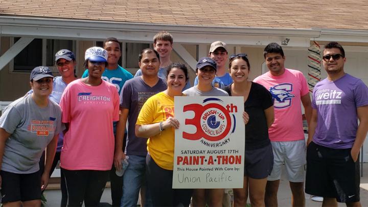 Fifteen Omaha-area volunteers from several ERGs participate in Brush Up Nebraska’s Paint-A-Thon, a community-based program that paints homes of qualified low-income elderly and disabled homeowners. 