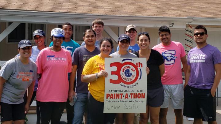 Fifteen Omaha-area volunteers from several ERGs participate in Brush Up Nebraska’s Paint-A-Thon, a community-based program that paints homes of qualified low-income elderly and disabled homeowners.