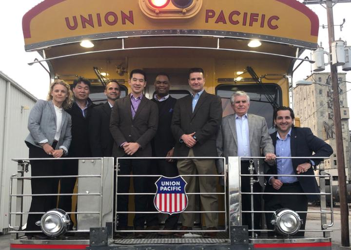 Jamey Stover, third from right, with Defense Fellows at a dinner onboard one of Union Pacific’s Heritage Fleet business cars.